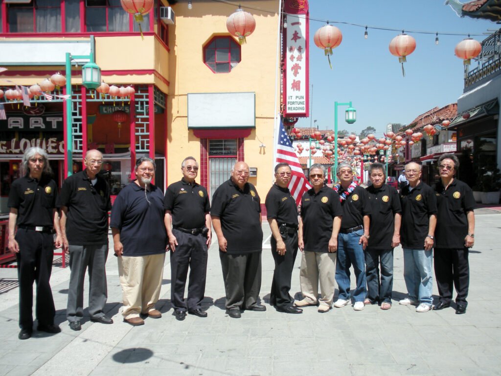 Post 628 veterans stand together with an American flag in Los Angeles’s Chinatown.